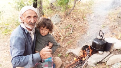 Servet Turgut died on September 30 of injuries incurred while in military custody. Pictured here in his village with his grandchild. ©2020 Private