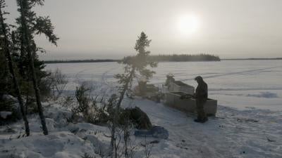 Sun sets over snowy plains