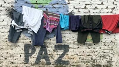 Graffiti in the city of Tumaco, Colombia, where FARC dissident groups operate, says "peace."