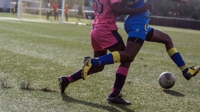 Residents of the Centre Technique National in Croix-des-Bouquets play in a match on May 12, 2020. Earlier this year, survivors and family members accused Haitian Football Federation president, Yves Jean-Bart, of raping young female players at the center and subjecting them to other abuses. 