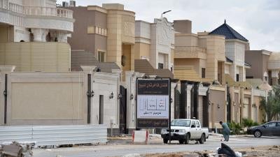 Foreign laborers work on the construction of new luxury houses in the Saudi capital, Riyadh, April 2019.