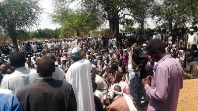 people. gathered. outside. funeral.