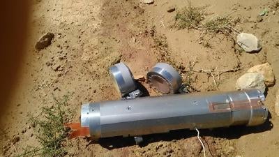 A failed BLU-108 canister, with two submunitions still attached, that was delivered by a CBU-105 Sensor Fuzed Weapon during an attack on the quarry of the Amran Cement Factory, Yemen, on February 15, 2016.