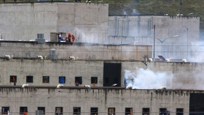 Tear gas rises from parts of Turi jail where an inmate riot broke out in Cuenca, Ecuador, February 23, 2021.