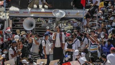 Demonstrators gather in an intersection close to Sule Pagoda to protest against the military coup in Yangon, Myanmar Wednesday, Feb. 17, 2021.