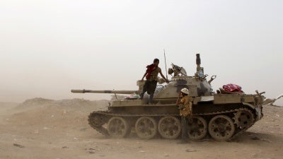 Members of UAE-backed southern Yemeni separatist forces stand by a tank during clashes with government forces in Aden, Yemen August 10, 2019.