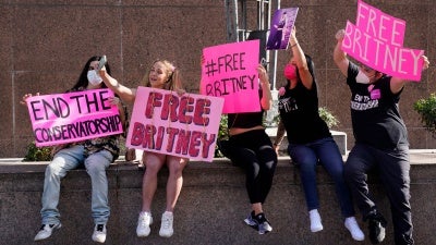 Britney Spears supporters pose for a photo outside a court hearing concerning the pop singer's conservatorship at the Stanley Mosk Courthouse in Los Angeles, February 11, 2021.