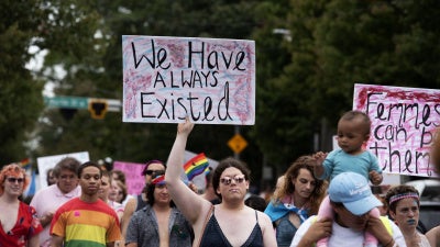 Transgender and non-binary individuals and their allies stroll through Atlanta’s Midtown district during Pride’s Transgender Rights March on Saturday, Oct. 12, 2019. 