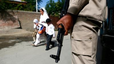 An Indian paramilitary soldier stands guard during a search operation in Srinagar, Kashmir, in August 2018.