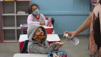 Student receives hand sanitizer at a public school in São Paulo on the first day of in-person classes, on February 8th.