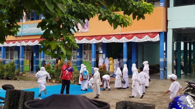 A primary state school in Solok, West Sumatra, where girls and teachers are required to wear the jilbab --Muslim apparel that covers the head, neck, and chest.