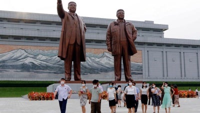 Visitors pay homage to the late North Korean leaders Kim Il Sung and Kim Jong Il ahead of the 27th anniversary of the death of Kim Il Sung, in Pyongyang, North Korea, on July 7, 2021. 