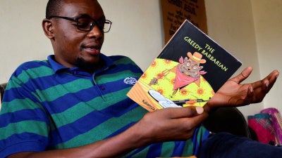 The Ugandan author of "Greedy Barbarian," Kakwenza Rukirabashaija, at his home in Iganga district in Eastern Uganda, May 11, 2020.