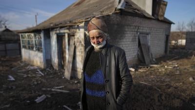 Tetyana Tomenko in front of her house, which was damaged during shelling in Novognativka, eastern Ukraine, February 20, 2022.