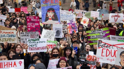 Participants of the rally holding signs
