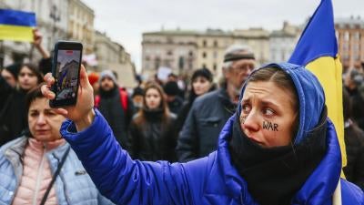 A protester holds up a phone during a demonstration