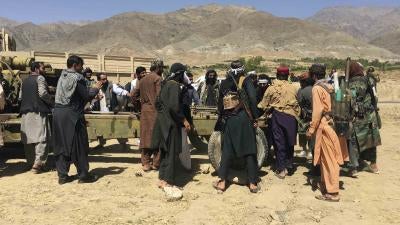 Taliban soldiers gather with weapons and machinery in Panjshir province, northern Afghanistan, September 8, 2021.