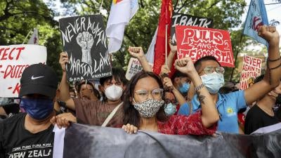 Activists protest against presidential candidate Ferdinand Marcos Jr. during a rally outside the Commission on Human Rights in Quezon City, the Philippines.