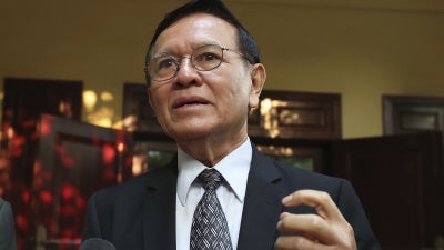 Cambodia’s opposition leader Kem Sokha talks to the media at his home before leaving for a court hearing in Phnom Penh.