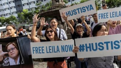 Supporters of former senator Leila de Lima outside the Hall of Justice in Muntinlupa City, Philippines, May 12, 2023.