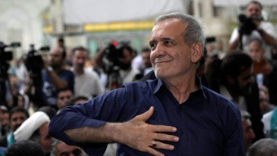 Iran's president Masoud Pezeshkian greets supporters in Tehran, July 6, 2024. 