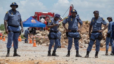 Police maintain a cordon around shaft 11 during rescue operations for trapped miners at the abandoned Buffelsfontein gold mine in Stilfontein, South Africa, January 14, 2025.