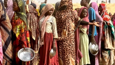 People in line for food rations in Sudan.