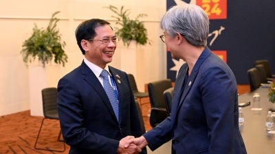 Australia's Foreign Minister Penny Wong (R) greets Vietnam's Foreign Minister Bui Thanh Son (L) during the 50th ASEAN-Australia Special Summit in Melbourne on March 5, 2024.