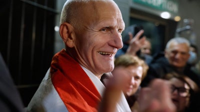 Nobel Peace Prize laureate Ales Bialiatski, one of released Belarusian prisoners, smiles as he arrives at the U.S. Embassy in Vilnius, Lithuania, on December 13, 2025.