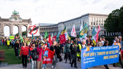 European activists march in Brussels on September 23, 2025 to protest EU governments’ efforts to weaken the EU’s corporate accountability law, the Corporate Sustainability Due Diligence Directive. 