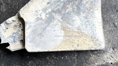 A remnant of a tail fin, found in Msayleh, of a US-produced Joint Direct Attack Munition (JDAM) guidance kit.