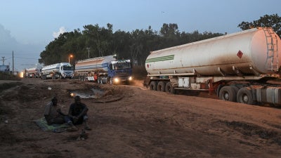 Malian tanker trucks drive at the entrance of Boundiali, northern Côte d'Ivoire, on the way to Yamoussoukro and Abidjan to load oil, October 30, 2025.