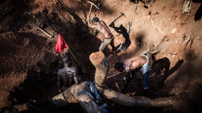 Artisanal miners excavate gold on the outskirts of Montepuez, Mozambique