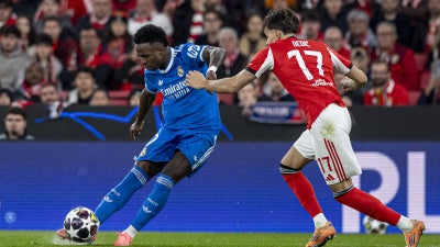 Real Madrid's Vinicius Junior shoots the ball to score teams first goal during a Champions League playoff soccer match between SL Benfica and Real Madrid in Lisbon, Portugal, February 17, 2026. 