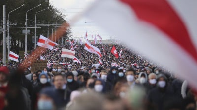People march in an opposition rally to protest the presidential election results in Minsk, Belarus, October 18, 2020.