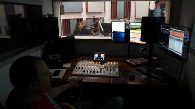 Employees of the Hungarian radio station Klubrádió work at its headquarters in Budapest, Hungary, February 6, 2025.