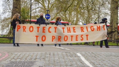 People rally to protect the right to protest in Central London, UK,  April 3, 2021.