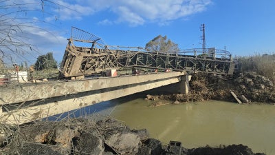 A damaged bridge over water