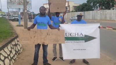 Joachim Paluku Kamate (left), Olivier Sefu Anjisina (center), and Jackson Kambale Odo in Bunia, Democratic Republic of Congo, March 12, 2026. 