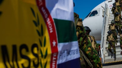 A contingent of police officers from Kenya arrives at Toussaint Louverture International Airport in Port-au-Prince, Haiti