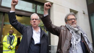 Ben Jamal and Chris Nineham, standing outside courthouse