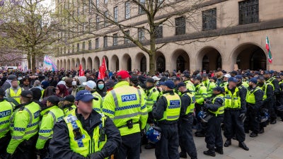 Anti-fascist supporters were kept apart from the Britain First demonstration by police in Manchester, UK, April 18, 2026. 