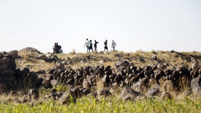 Ethiopian migrants seeking asylum or a better life in Gulf States, walk along a highway to Saadah province to cross into Saudi Arabia, on August 23, 2023 on the outskirts of Sana'a, Yemen.