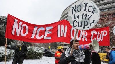 Demonstrators against the FIFA 2026 World Cup draw take part in a protest called "No ICE in my Cup!", in Washington, December 5, 2025.