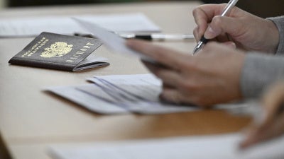 A Russian passport in review in Moscow, March 25, 2025.