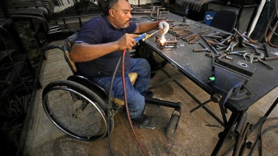 A man with a physical disability builds mobility products for underserved communities in Cairo, Egypt, August 8, 2017.