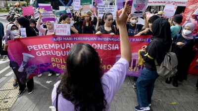 People rally on International Women's Day in Jakarta demanding the Indonesian government pass an anti-discrimination law and ratify the International Labor Organization (ILO) convention concerning the elimination of sexual violence and harassment at work, March 8, 2024.