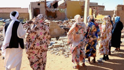 People pray for the victims of a drone strike in El Obeid, North Kordofan State, Sudan, January 12, 2026.