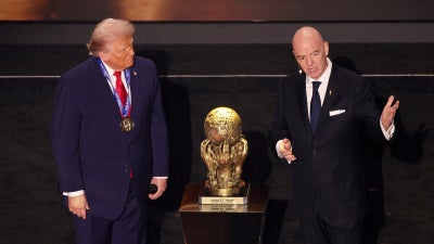 US President Donald Trump is presented with the inaugural FIFA Peace Prize award by FIFA President Gianni Infantino, January 9, 2026.