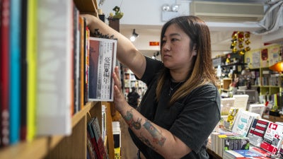 Leticia Wong, a former pro-democracy district councillor, at her bookstore in Hong Kong, June 20, 2025.